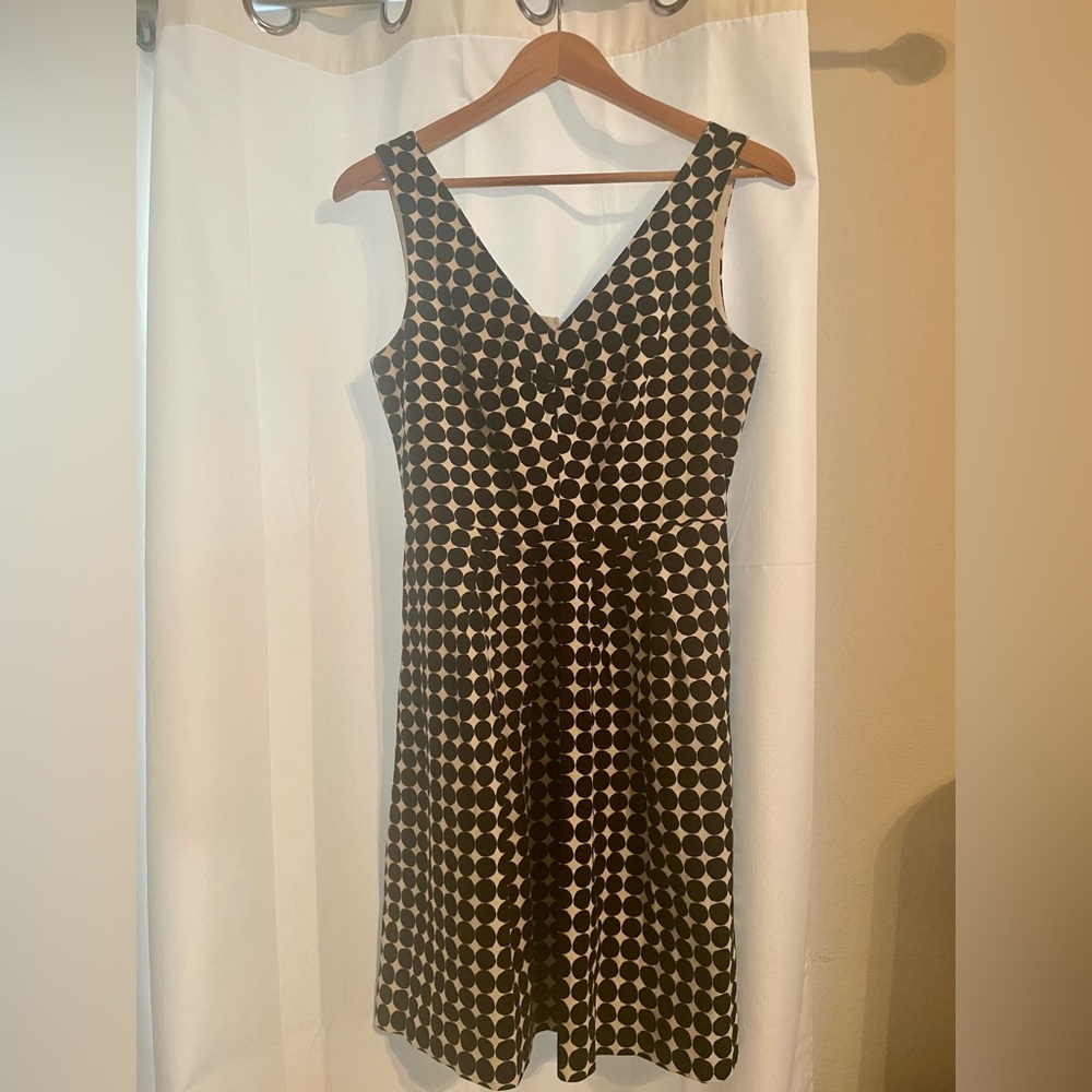 Multi purpose black and white dress with flattering neckline and flare skirt.